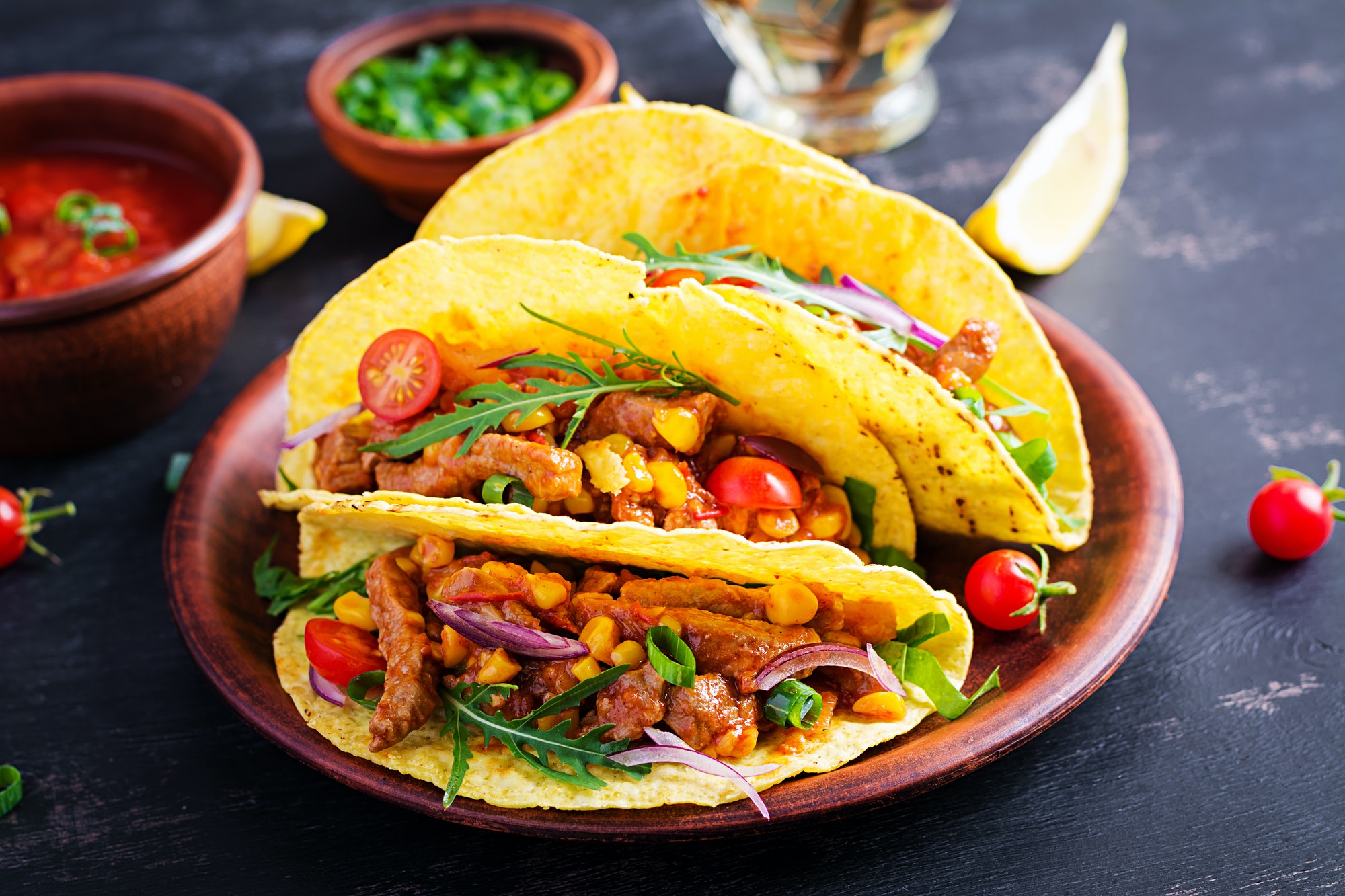 Taco. Mexican tacos with beef meat, corn and salsa. Mexican cuisine. copy space.