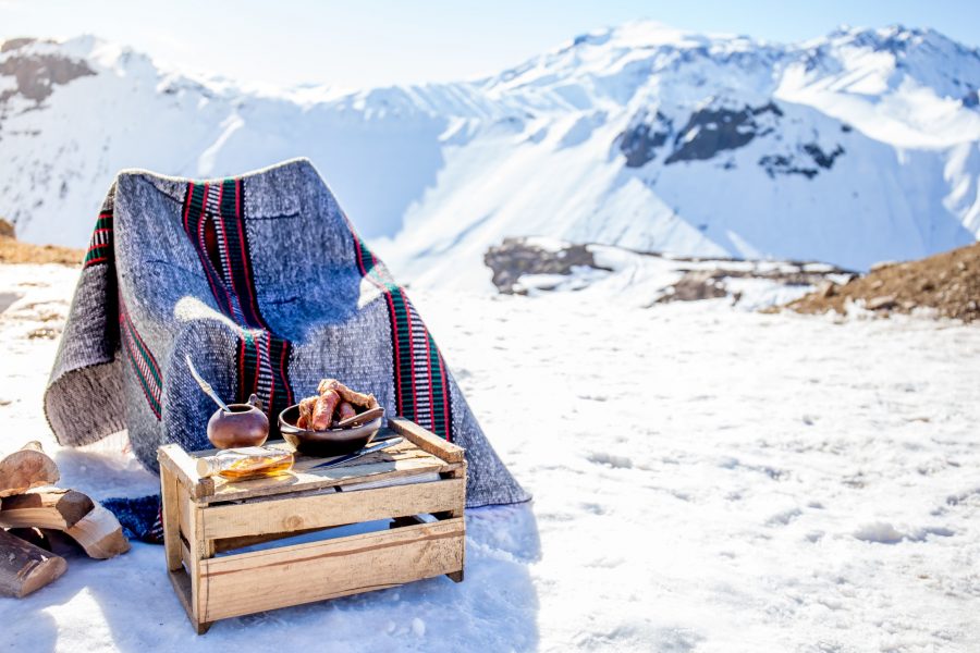 Winter picnic in chilean argentine with hot meat food and drink yerba mate