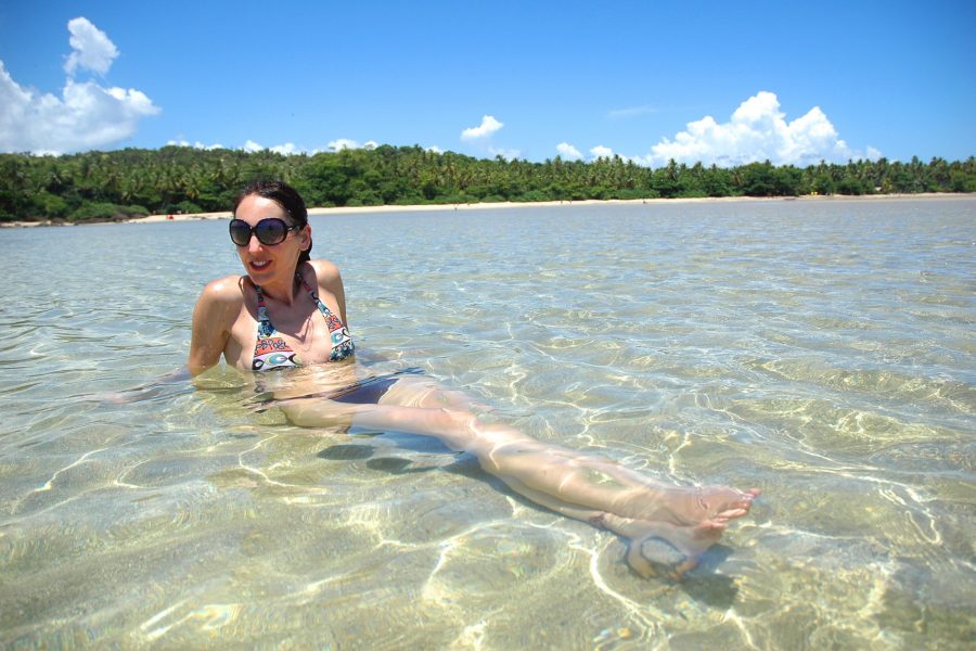 Woman in bikini relaxing on the sea in tropical beach